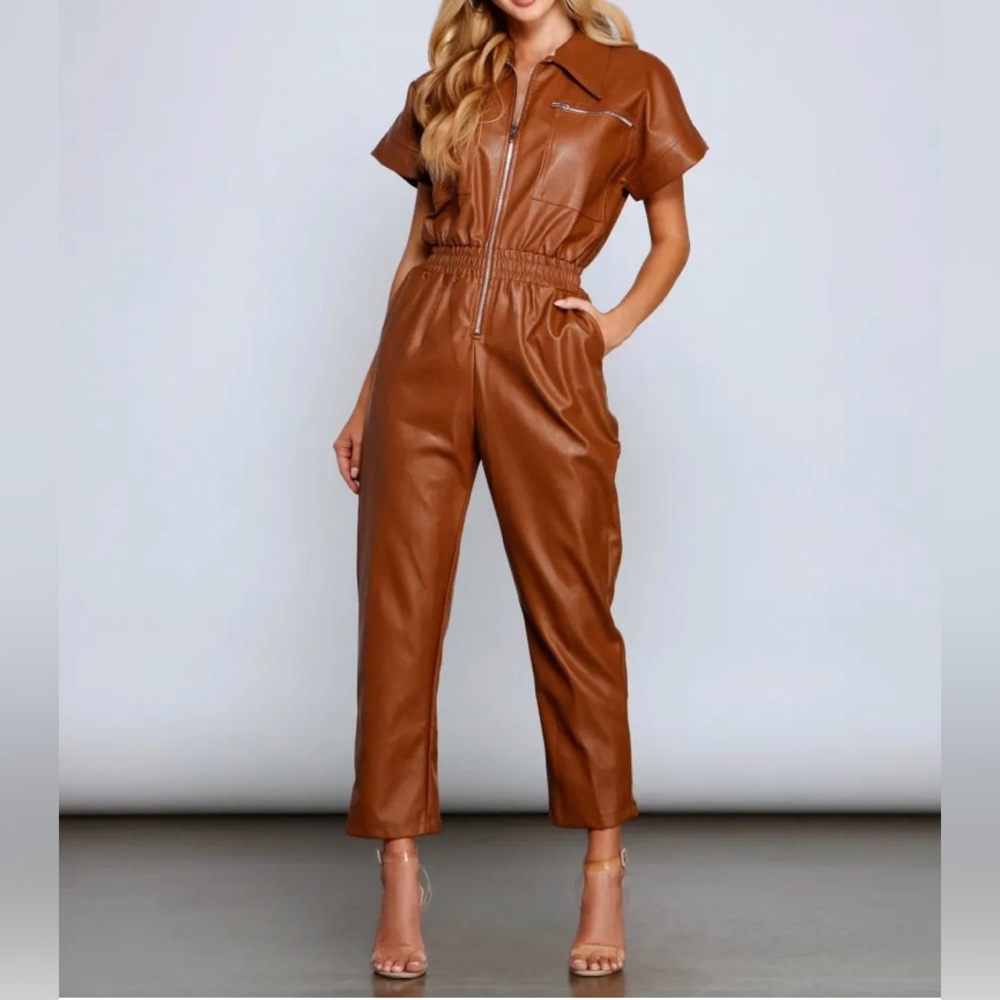 Brown faux lather jumpsuit. Zipper accents.